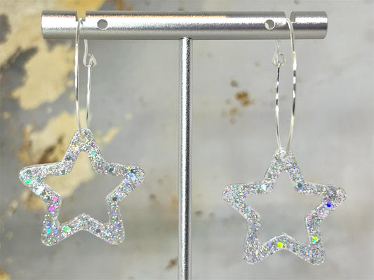 Handmade Star Resin Earrings with silver holographic glitter, silver plated hoops, different hoop sizes.