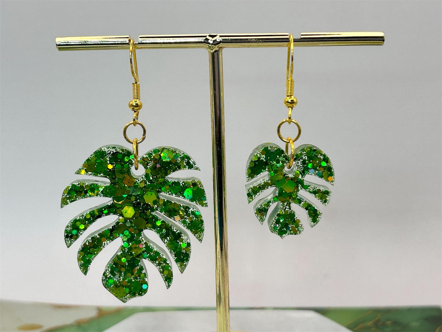 Handmade Glitter Monstera Leaf Earrings: Green Resin on Gold Plated Hooks