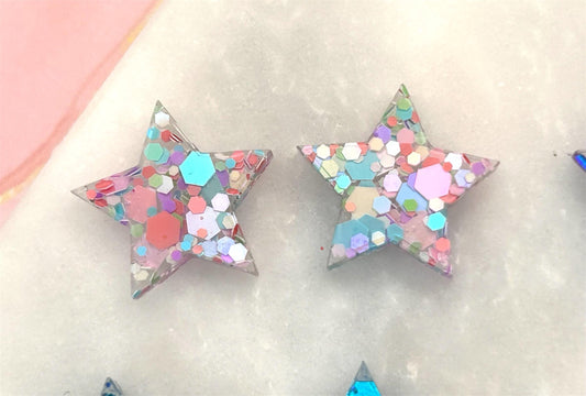 Handmade Resin Star Stud Earrings with Glitter and Sterling Silver. Perfect for a gift or treat yourself!