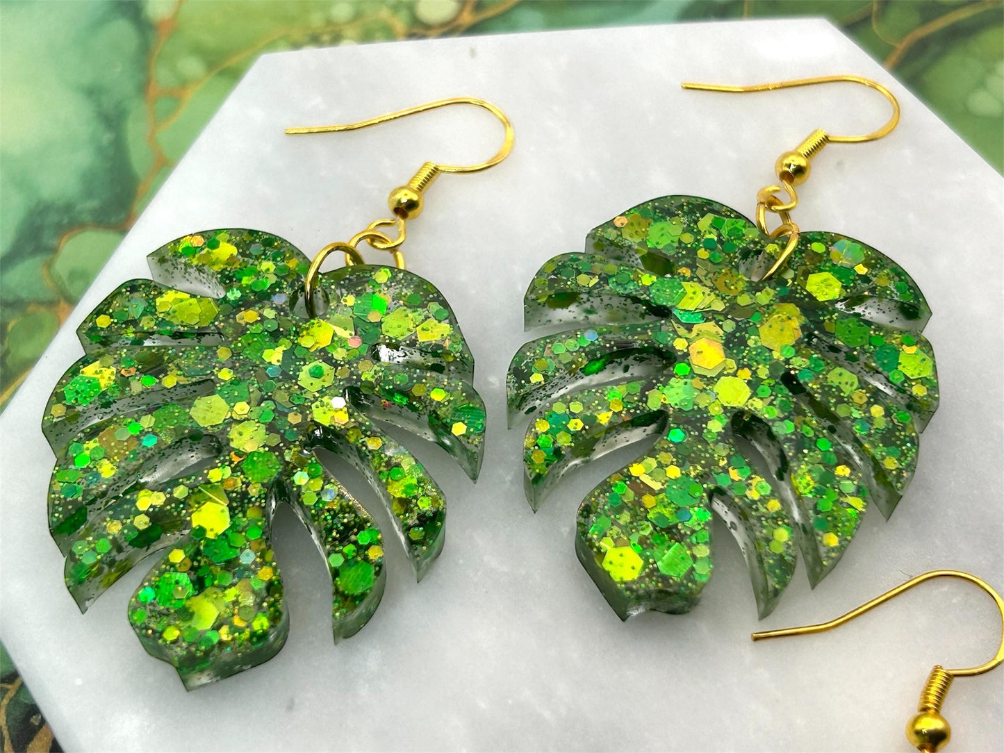 Handmade Glitter Monstera Leaf Earrings: Green Resin on Gold Plated Hooks