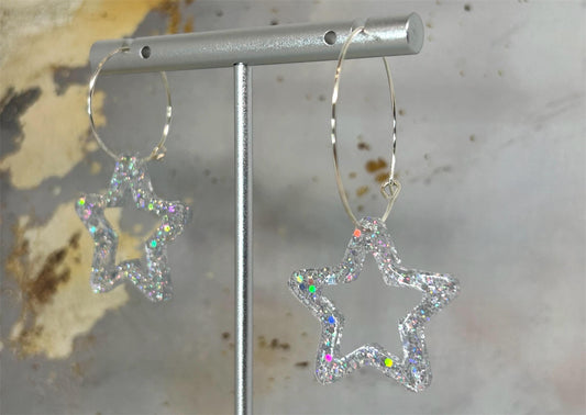 Handmade Star Resin Earrings with silver holographic glitter, silver plated hoops, different hoop sizes.